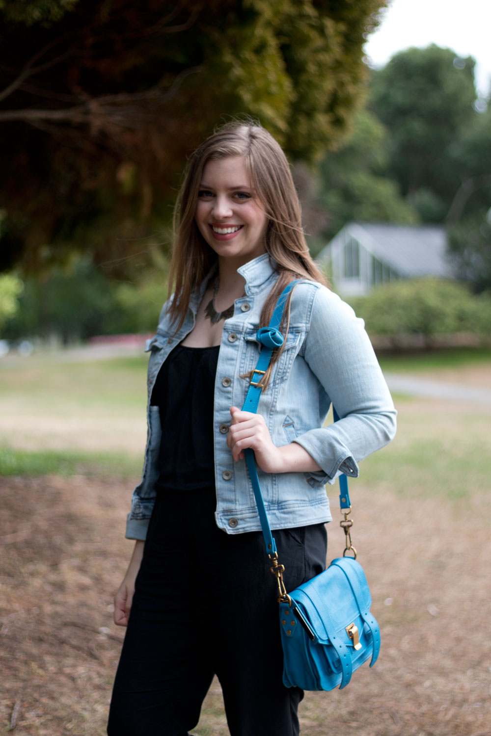 jean jacket with black jumpsuit